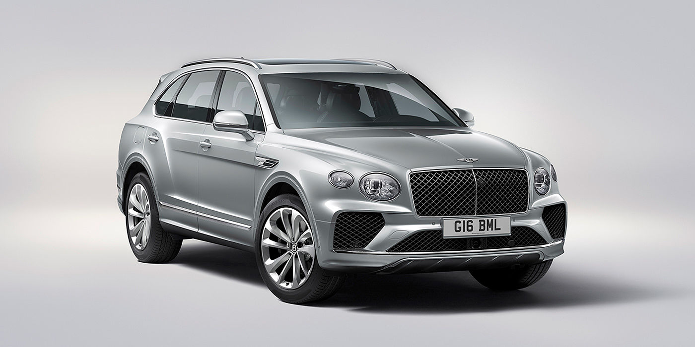 Bentley Auckland Bentley Bentayga in Moonbeam paint, front three-quarter view, featuring a matrix grille and elliptical LED headlights.