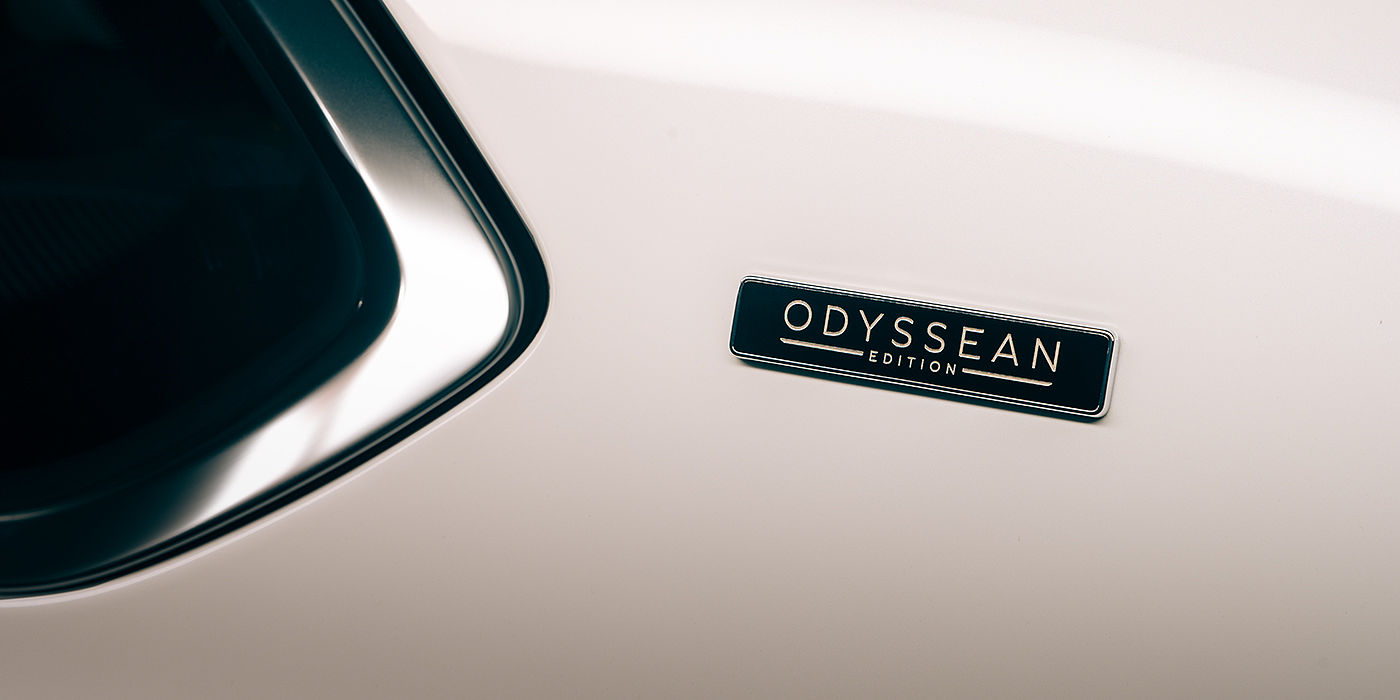 Bentley Auckland Bentley Bentayga Odyssean Edition SUV Odyssean badge close up with Snow Quartz Pearlescent by Mulliner paint