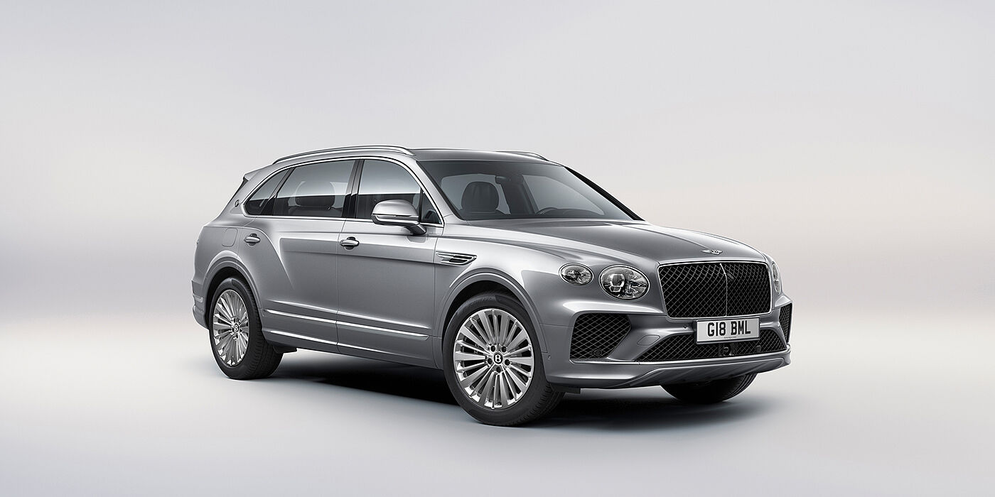 Bentley Auckland Bentley Bentayga Extended Wheelbase luxury SUV front three quarter view in Moonbeam paint with 21 inch five spoke painted wheels