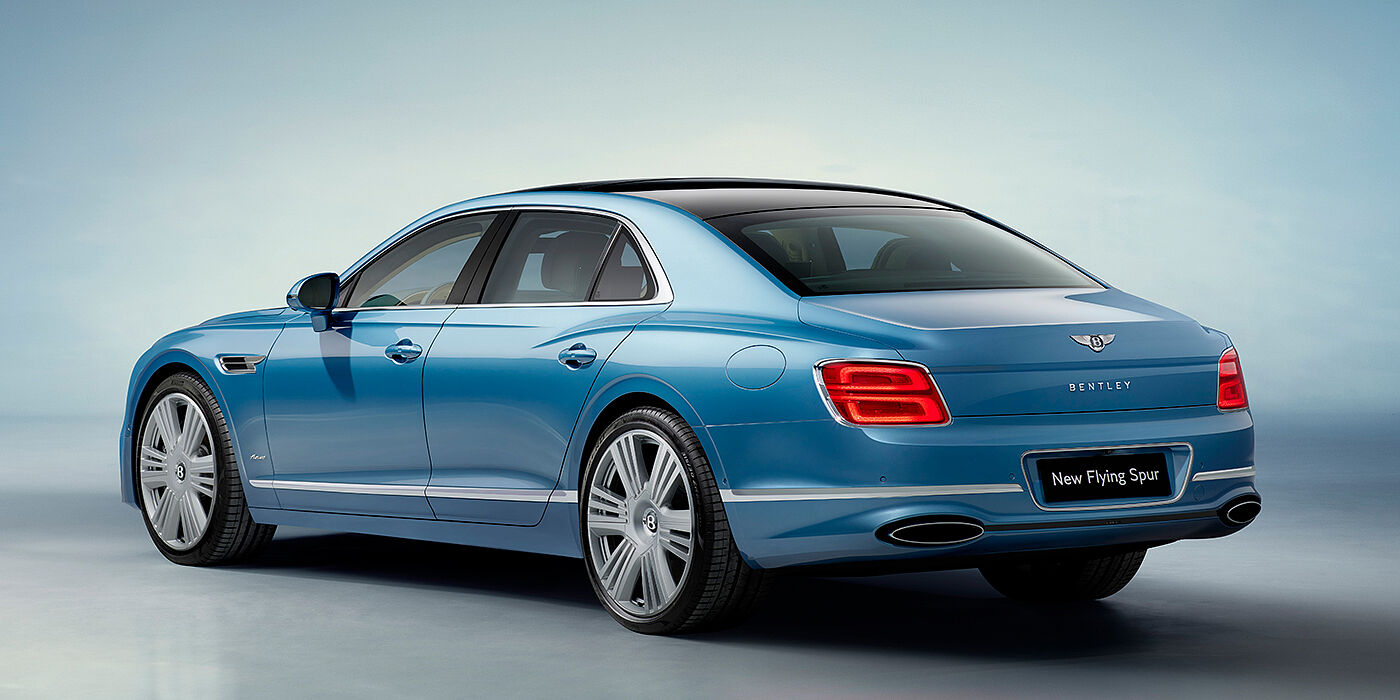 Bentley Auckland New Bentley Flying Spur Azure sedan rear view in Light windsor blue by Mulliner paint with 22 inch Azure wheels and chrome exterior details