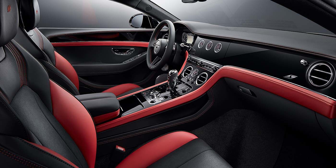 Bentley Auckland Bentley Continental GT S coupe front interior in Beluga black and Hotspur red hide with high gloss Carbon Fibre veneer