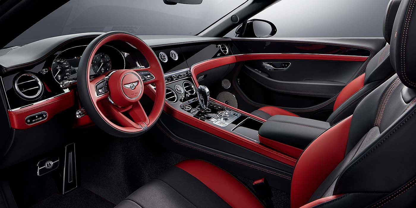 Bentley Auckland Bentley Continental GTC S convertible front interior in Beluga black and Hotspur red hide with high gloss carbon fibre veneer