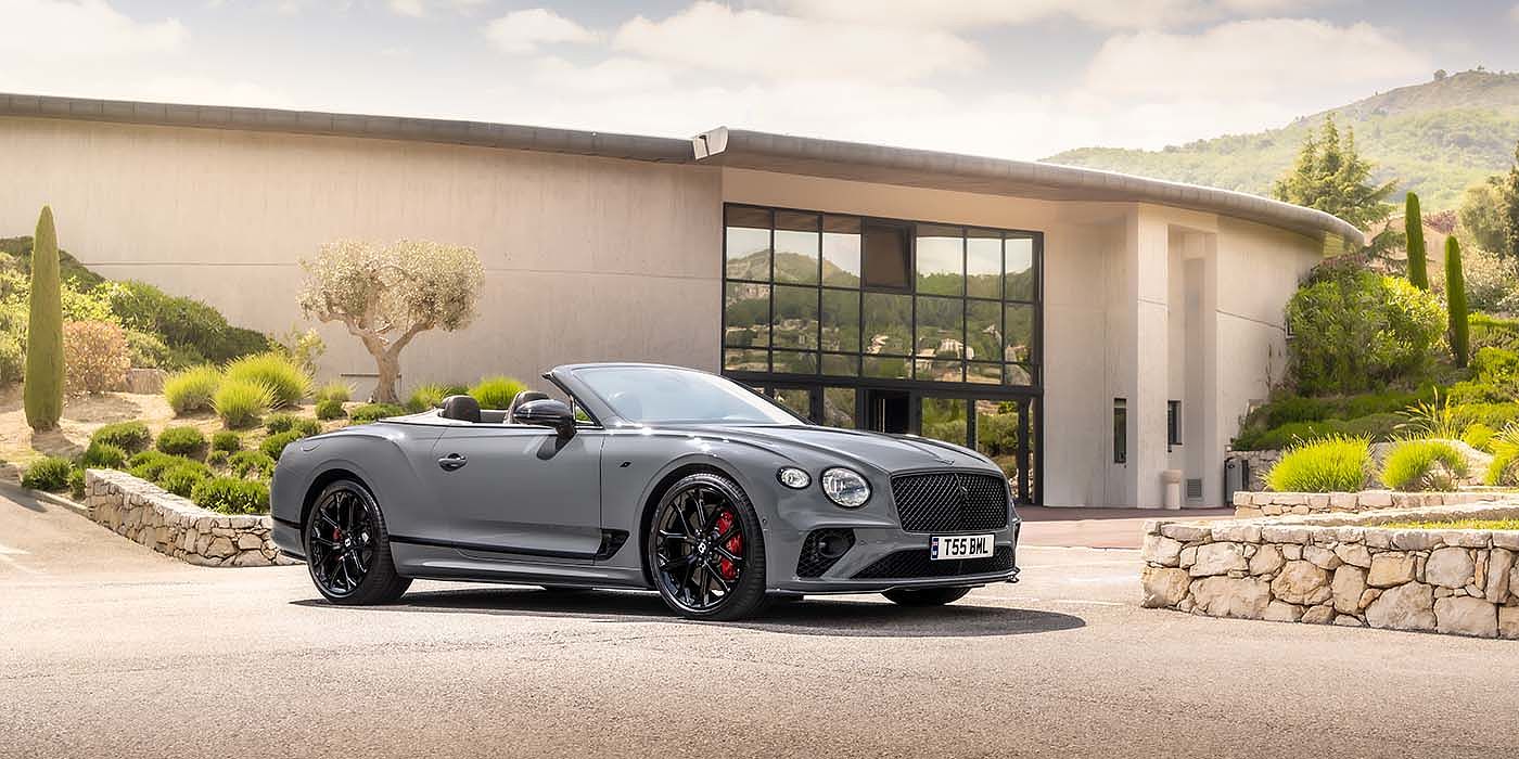 Bentley Auckland Bentley Continental GTC S convertible in Cambrian Grey paint front 34 static near house