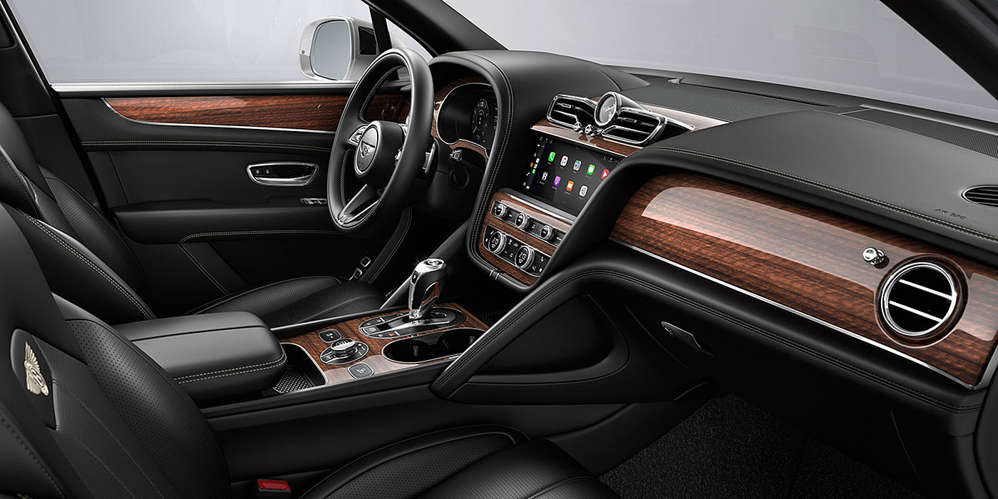 Bentley Auckland Bentley Bentayga interior with a Crown Cut Walnut veneer, view from the passenger seat over looking the driver's seat.