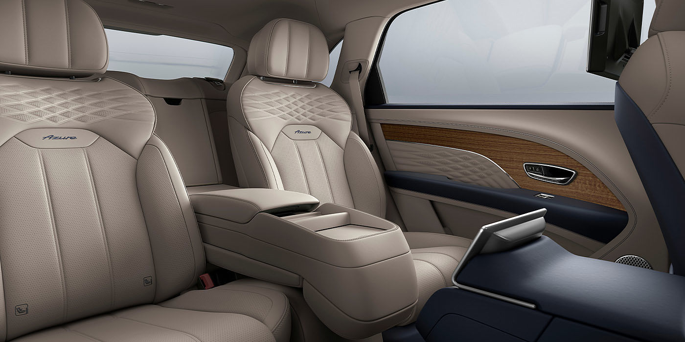 Bentley Auckland Bentley Bentayga EWB Azure interior view for rear passengers with Portland hide featuring Azure Emblem in Imperial Blue contrast stitch.
