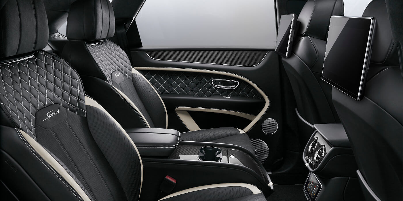 Bentley Auckland Bentley Bentayga Speed SUV rear interior in Beluga black and Linen hide with carbon fibre veneer