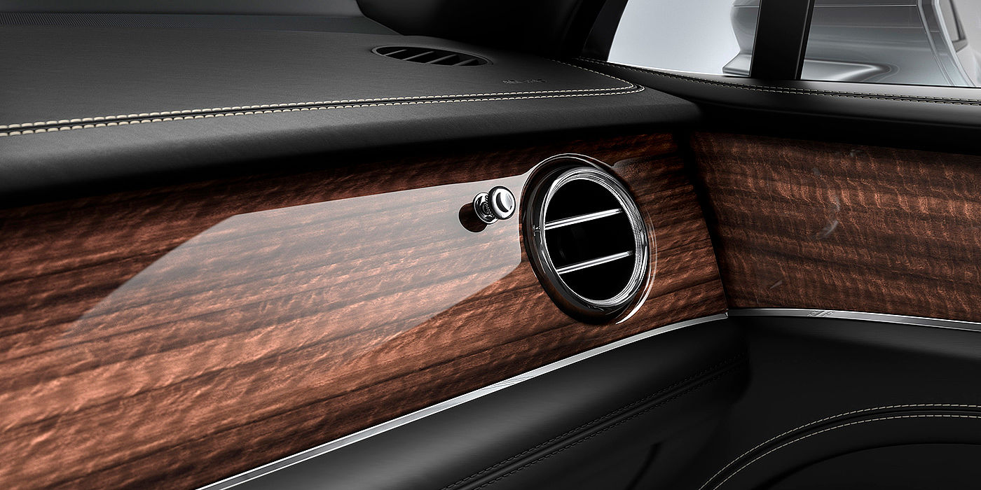 Bentley Auckland Bentley Bentayga front interior Crown Cut Walnut veneer and chrome air vent.