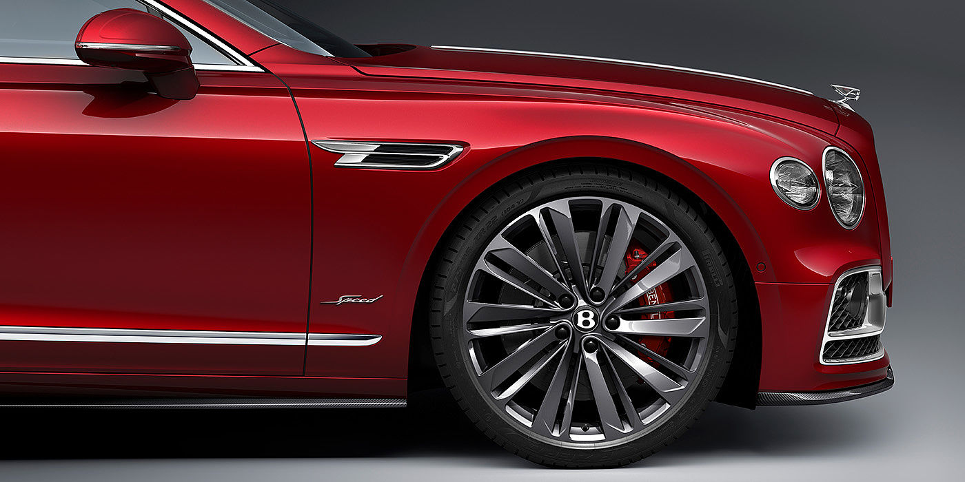 Bentley Auckland Bentley Flying Spur Speed sedan front wheel in close up with Dragon Red II paint