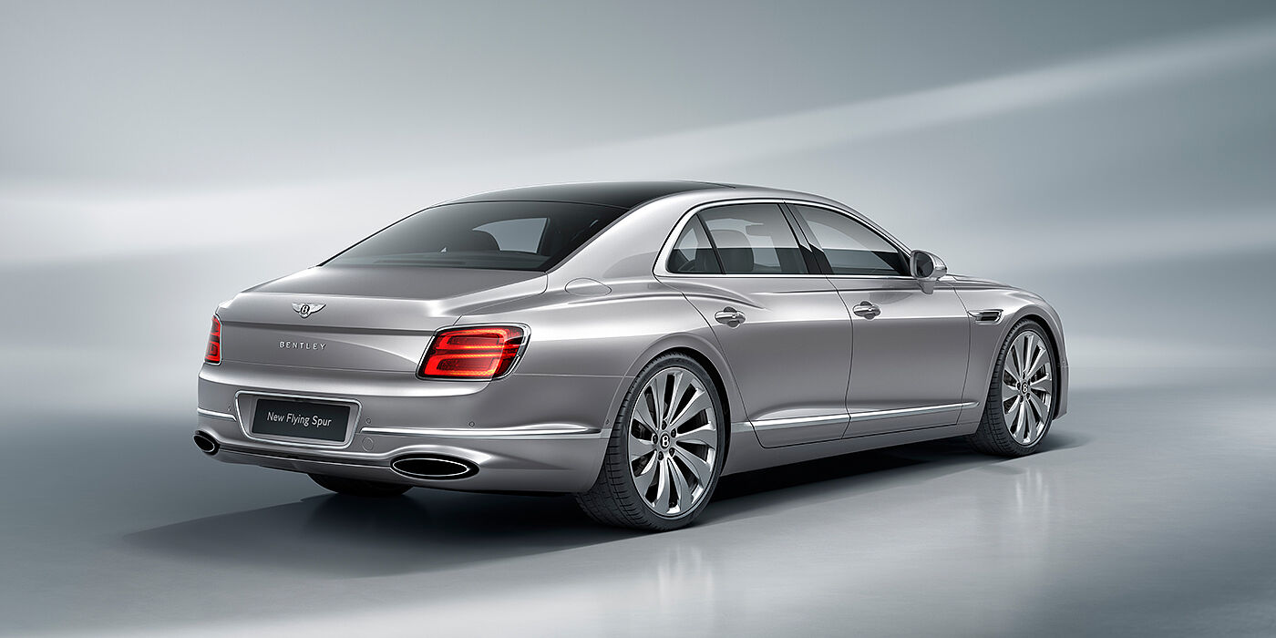 Bentley Auckland New Bentley Flying Spur sedan rear view in Silverlake paint with ten spoke wheels and chrome matrix grille