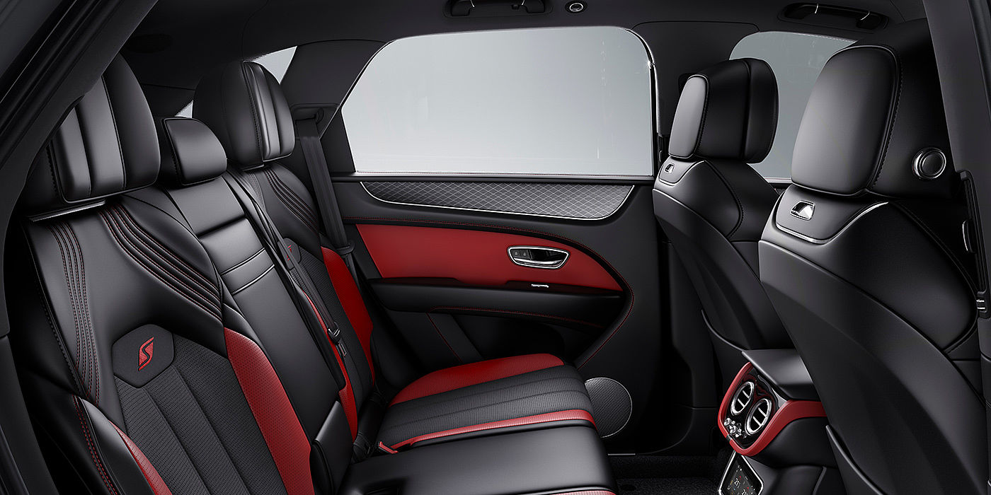Bentley Auckland Bentey Bentayga S interior view for rear passengers with Beluga black and Hotspur red coloured hide.