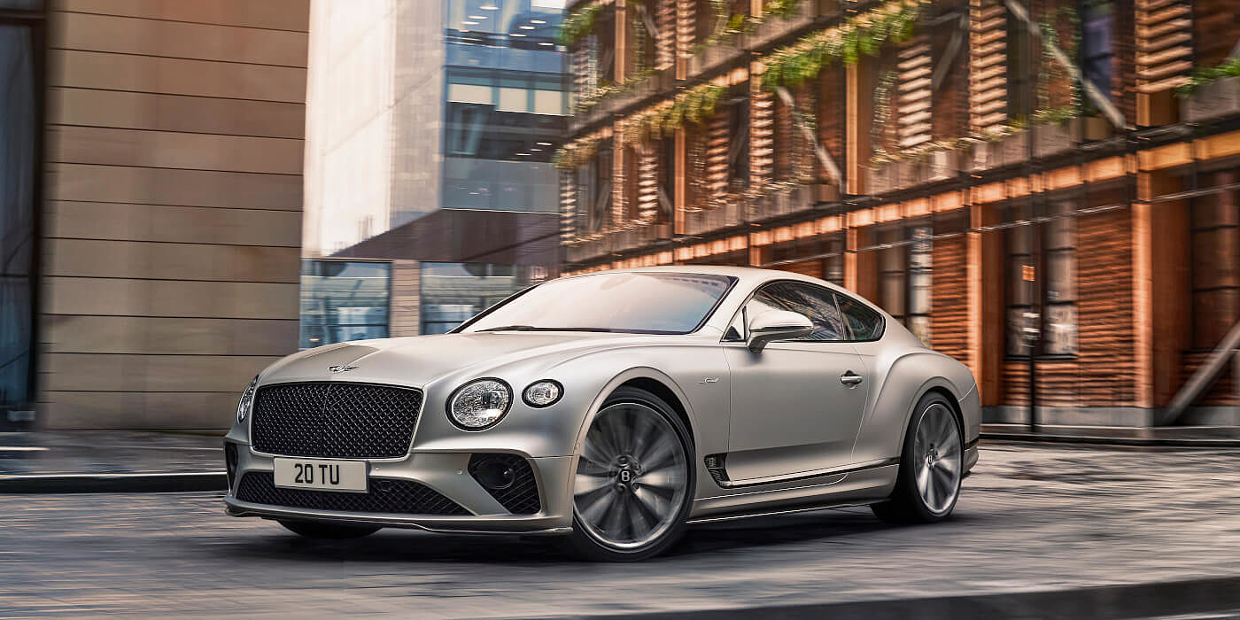 new-bentley-continental-gt-speed-in-satin-silver-by-mulliner-paint-driving-in-manchester
