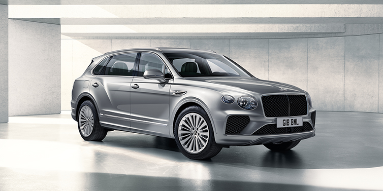 Bentley Auckland Bentley Bentayga Extended Wheelbase SUV front three quarter in Moonbeam paint with a grey background
