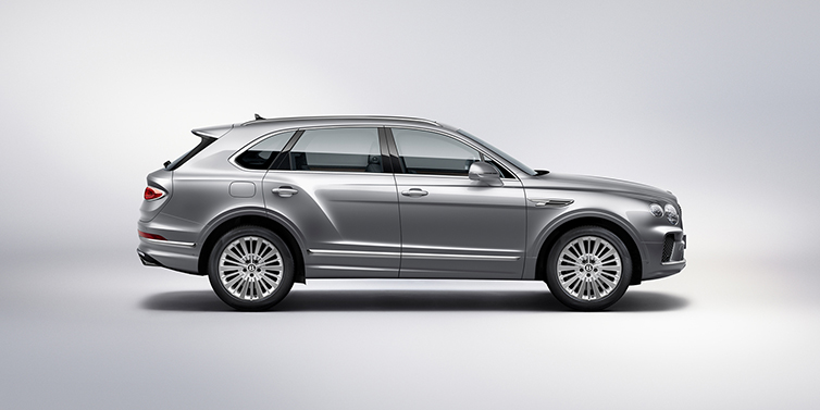 Bentley Auckland Bentley Bentayga SUV side profile in Moonbeam silver paint against white background featuring 21 inch 5 spoke wheels