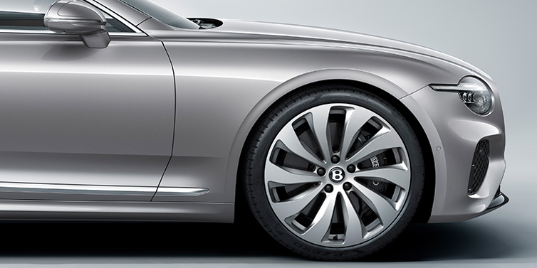 Bentley Auckland New Bentley Continental GT coupe side view featuring bonnet in Silverlake paint and 22 inch ten spoke silver painted and bright machined wheel