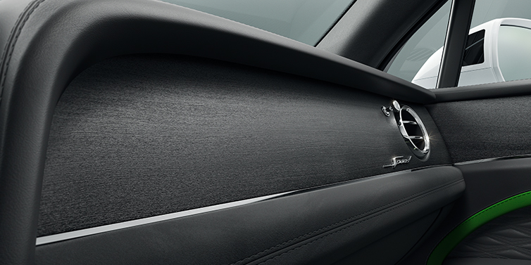 Bentley Auckland Bentley Bentayga Speed SUV front dash close up in Hyper Green and Beluga black hides, with Black Stained Crown Cut Walnut veneer