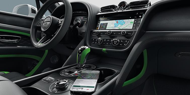 Bentley Auckland Bentley Bentayga Speed SUV front cabin in Hyper Green and Beluga black hides, with Black Stained Crown Cut Walnut veneer